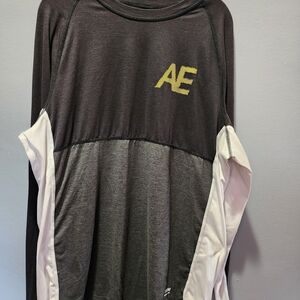 Nike Black Long Sleeve Top with Gold Ring Accent